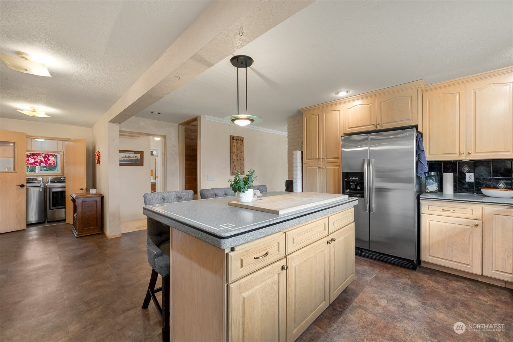 3941 Loomis Trail Road Blaine, WA 98230 - Photo 16 of 40 a kitchen with a refrigerator a sink dishwasher a oven and a dining table with wooden floor