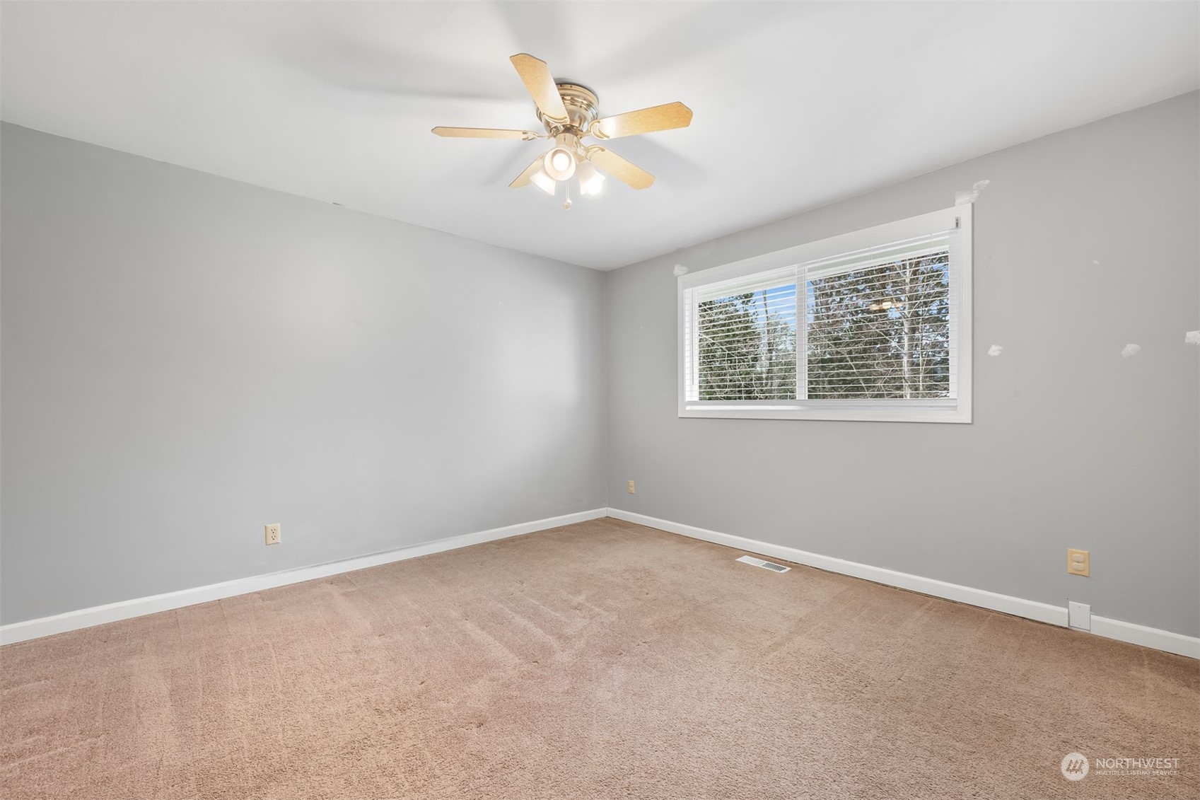 3941 Loomis Trail Road Blaine, WA 98230 - Photo 25 of 40 an empty room with fan and windows