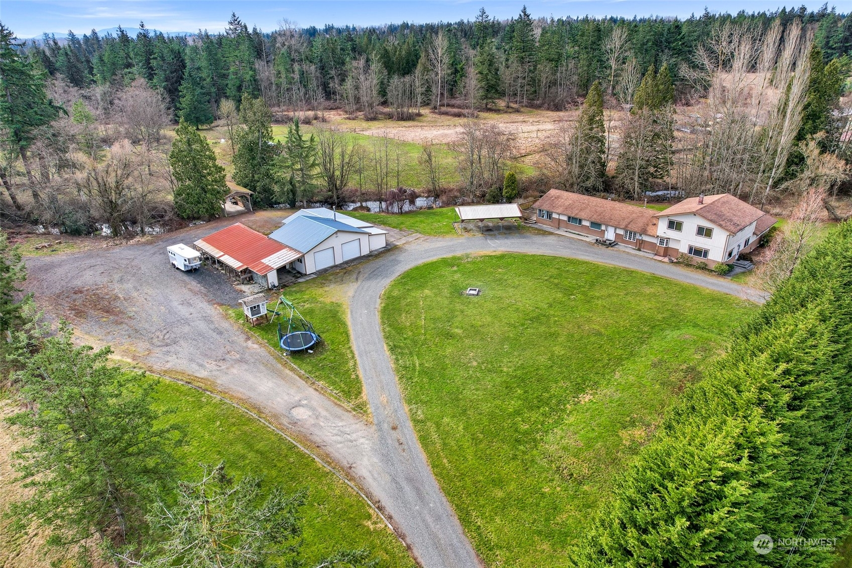 3941 Loomis Trail Road Blaine, WA 98230 - Photo 39 of 40 a backyard of a house with yard and outdoor seating