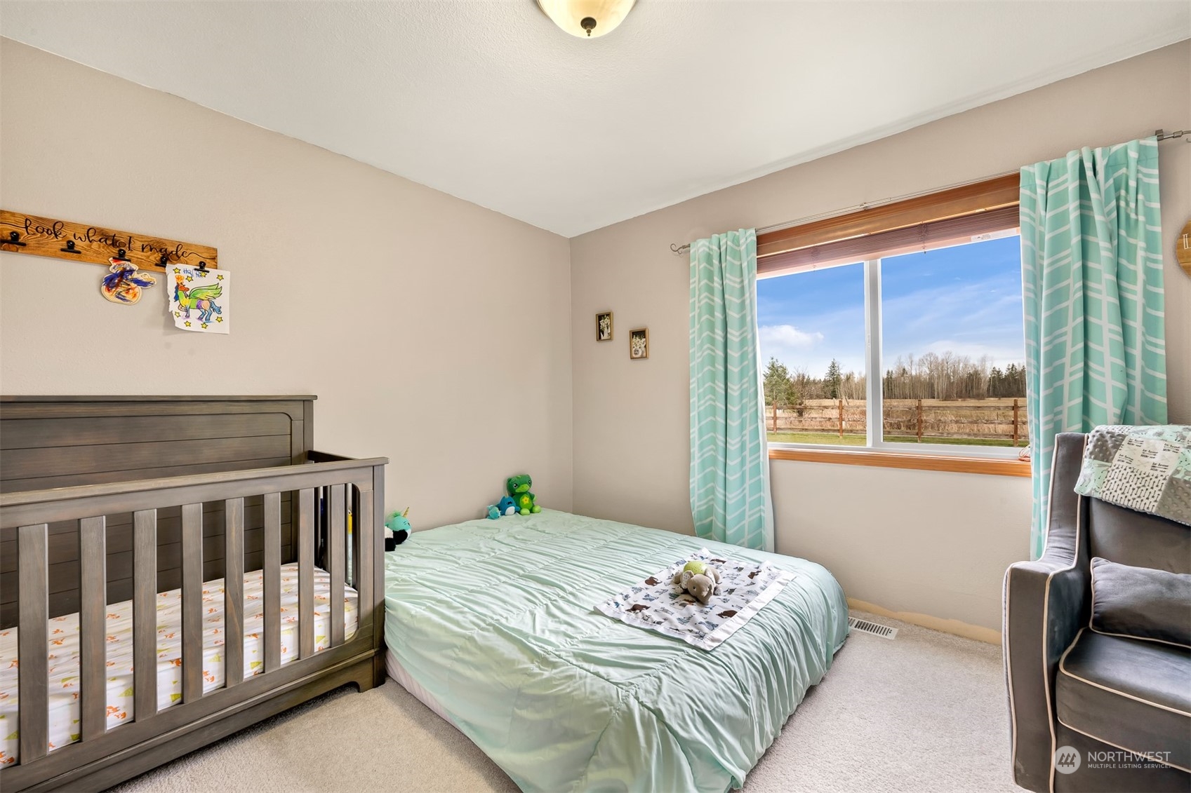 3941 Loomis Trail Road Blaine, WA 98230 - Photo 10 of 40 a bedroom with a bed and glass window