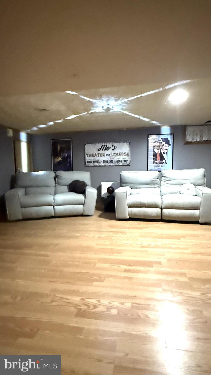 654 Buckshutem Road Bridgeton, NJ 08302 - Photo 12 of 14 a view of a living room with furniture and a ceiling fan