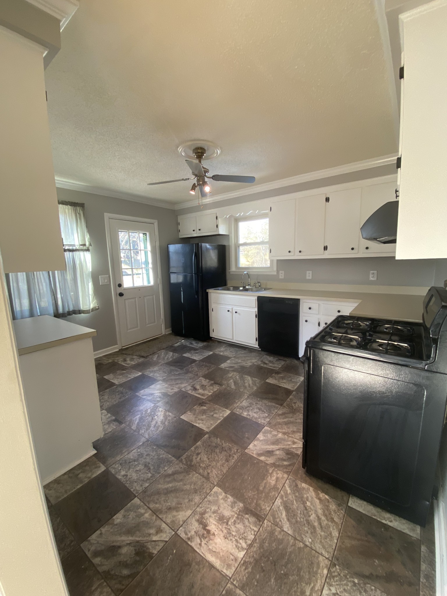 204 Paddock Road Clarksville, TN 37043 - Photo 19 of 29 a kitchen with stainless steel appliances granite countertop a sink a stove top oven a counter space and cabinets