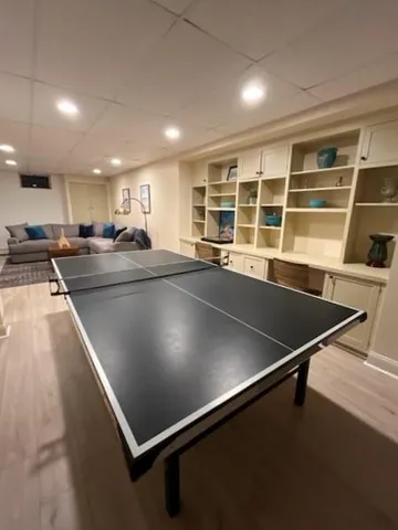 a view of a kitchen with kitchen island a counter tops and a window