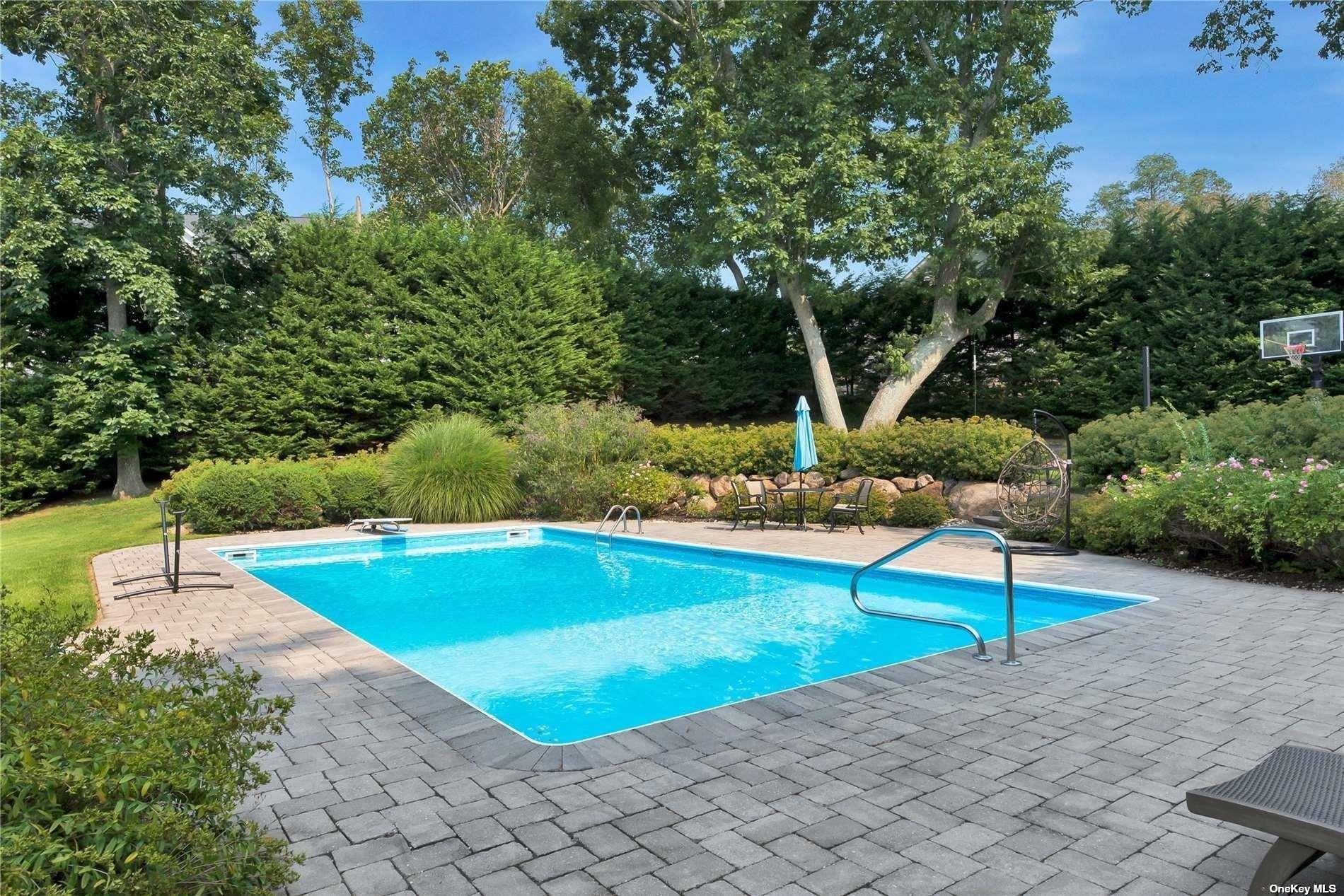 1460 Hillcrest Drive Orient, NY 11957 - Photo 3 of 37 a view of a backyard with swimming pool