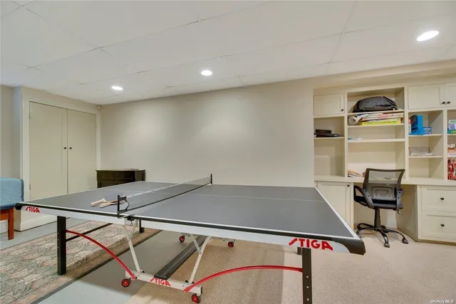 a view of a house with backyard sitting area and garden