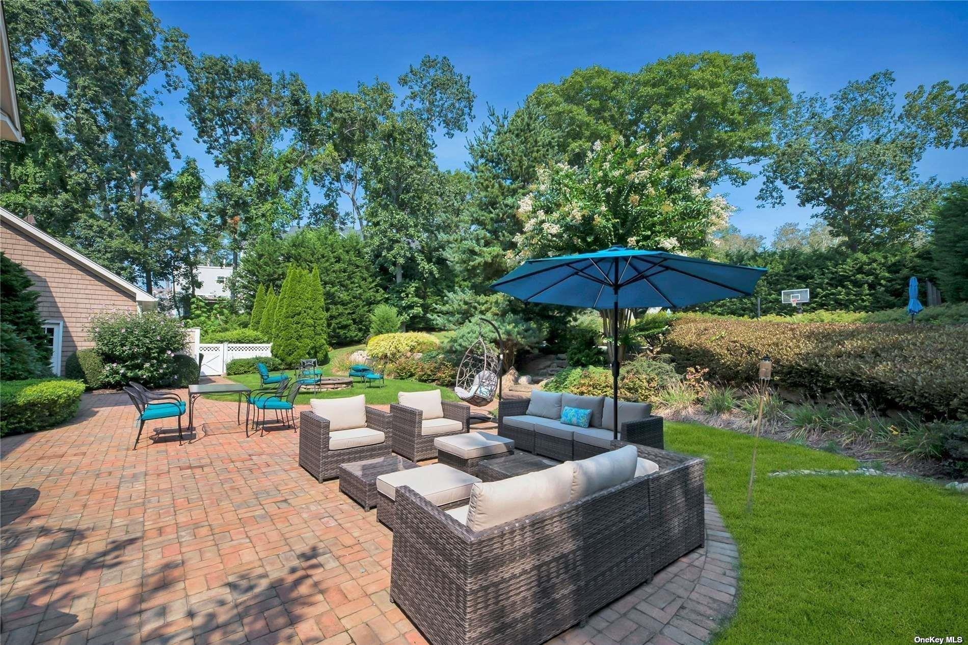 1460 Hillcrest Drive Orient, NY 11957 - Photo 34 of 37 an outdoor sitting area with a garden view