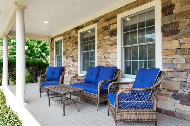a outdoor living space with furniture and a potted plant
