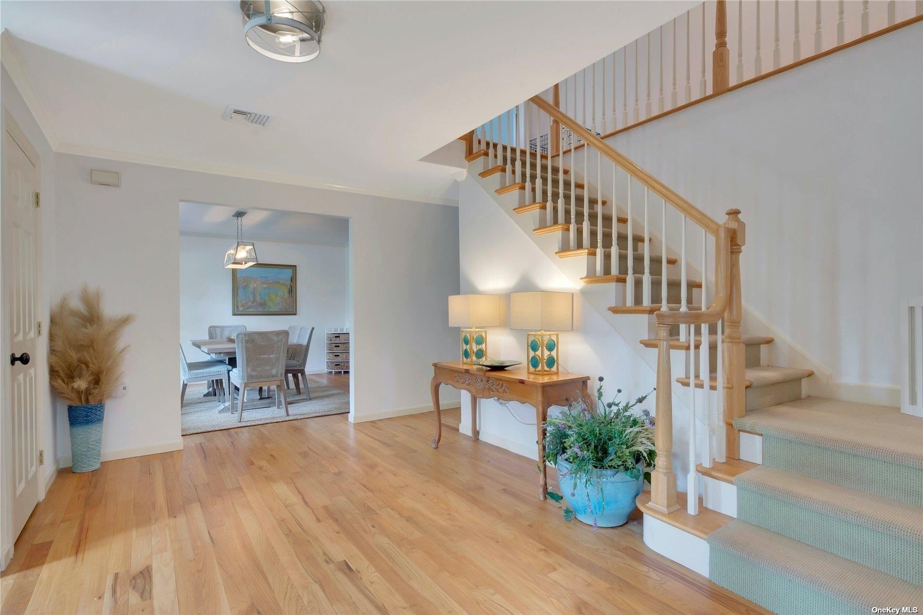 1460 Hillcrest Drive Orient, NY 11957 - Photo 9 of 37 a view of entryway dining room and hall with wooden floor