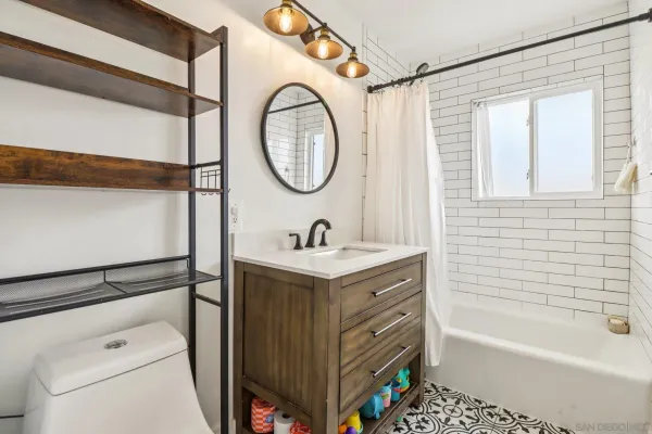 a bathroom with a sink a toilet and a bathtub