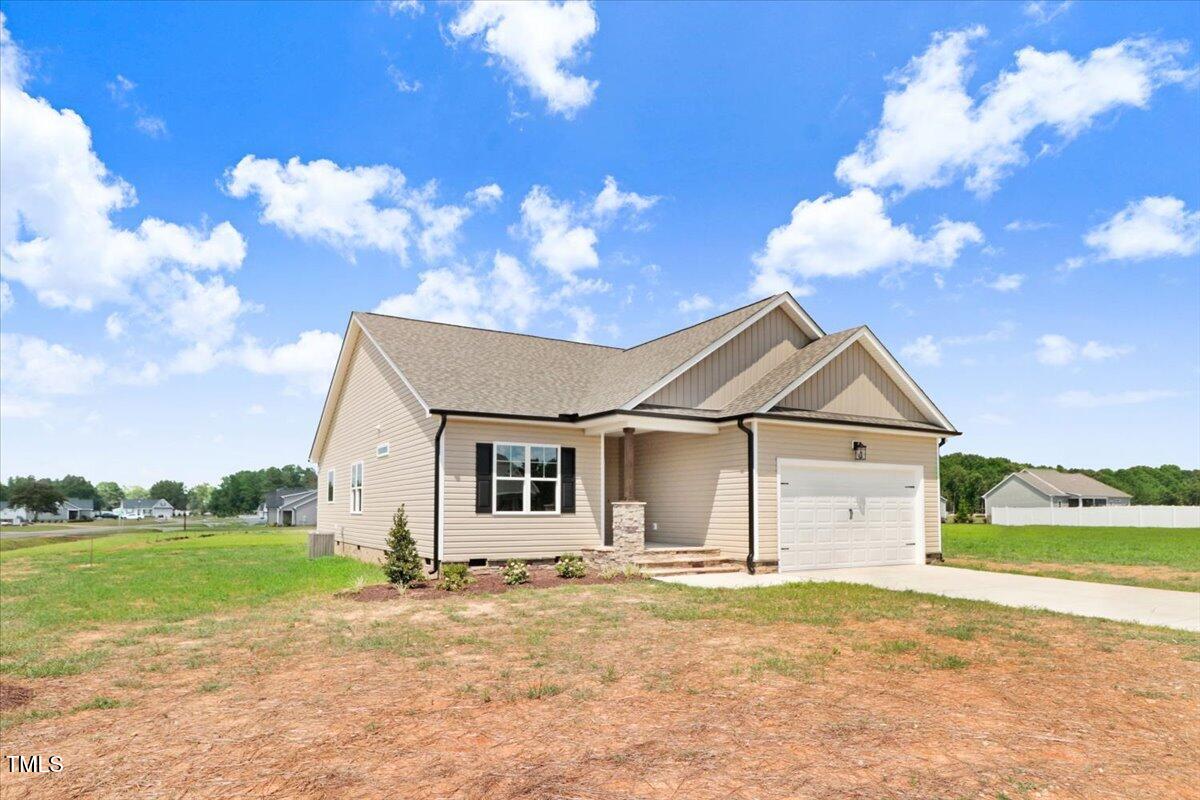 9550 Bear Run Lane Middlesex, NC 27557 - Photo 2 of 32 a view of a house with backyard and garden