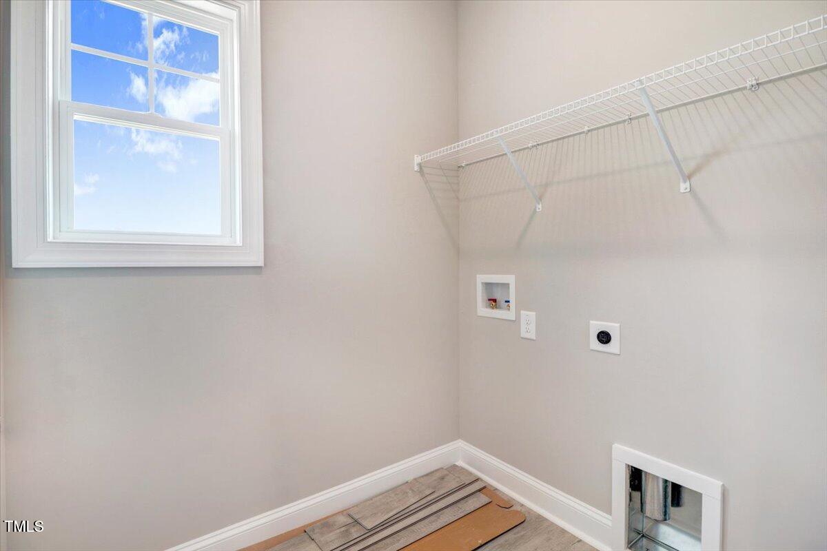 9550 Bear Run Lane Middlesex, NC 27557 - Photo 31 of 32 a view of a small space with racks on the wall