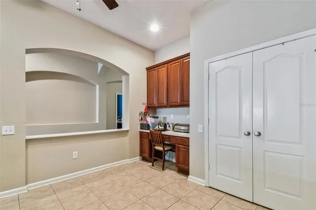 a view of kitchen with furniture and cabinets