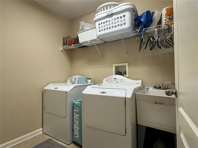 a utility room with dryer and washer