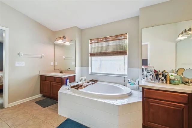 a bathroom with a sink double vanity and a mirror