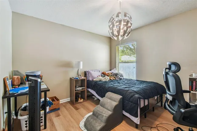 a bedroom with furniture and a bed