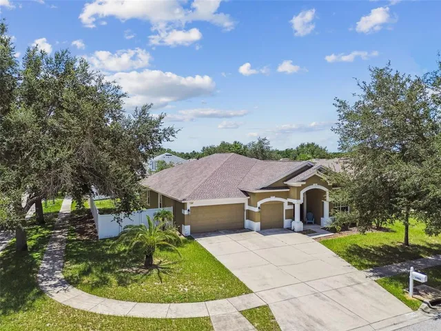 a aerial view of a house with a yard