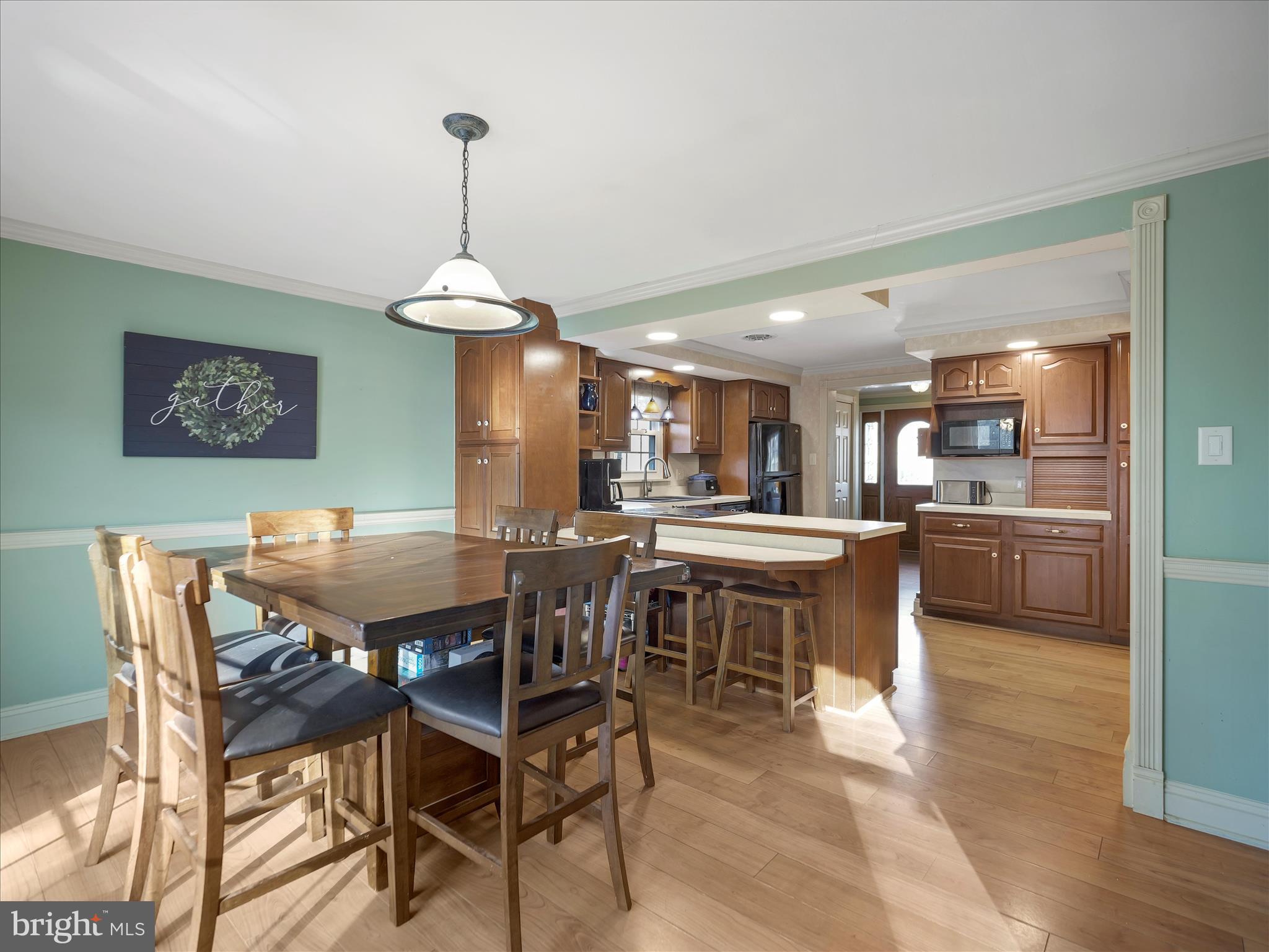 20315 Old Forge Road Hagerstown, MD 21742 - Photo 12 of 71 a dining area with a table chairs and a kitchen