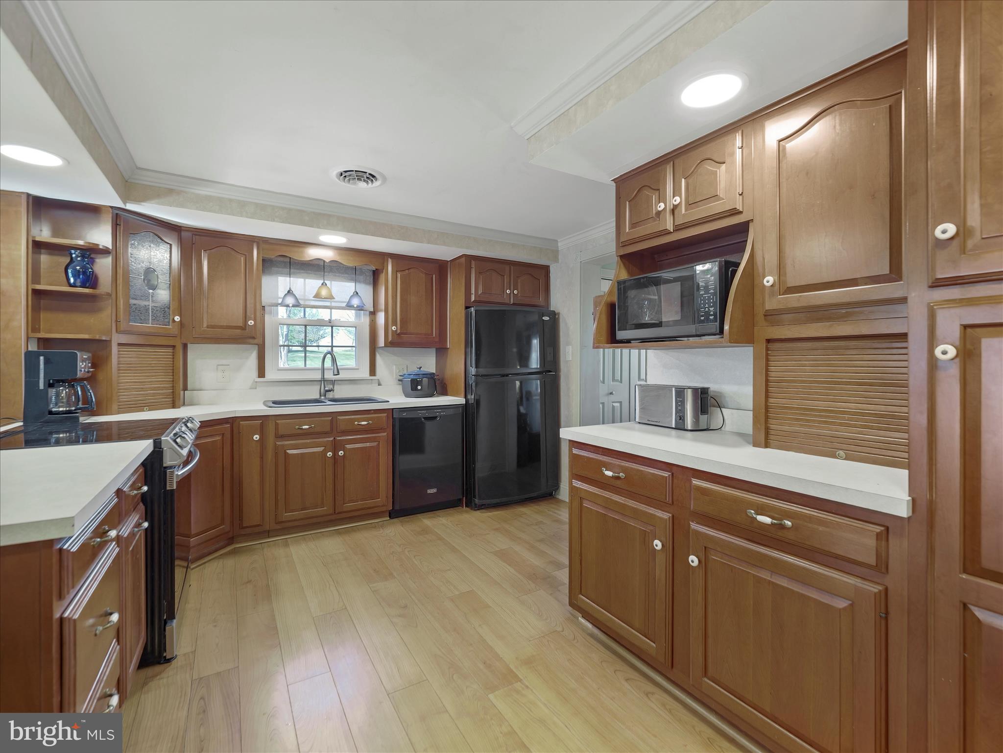 20315 Old Forge Road Hagerstown, MD 21742 - Photo 13 of 71 a kitchen with stainless steel appliances kitchen island granite countertop a stove a sink and a microwave