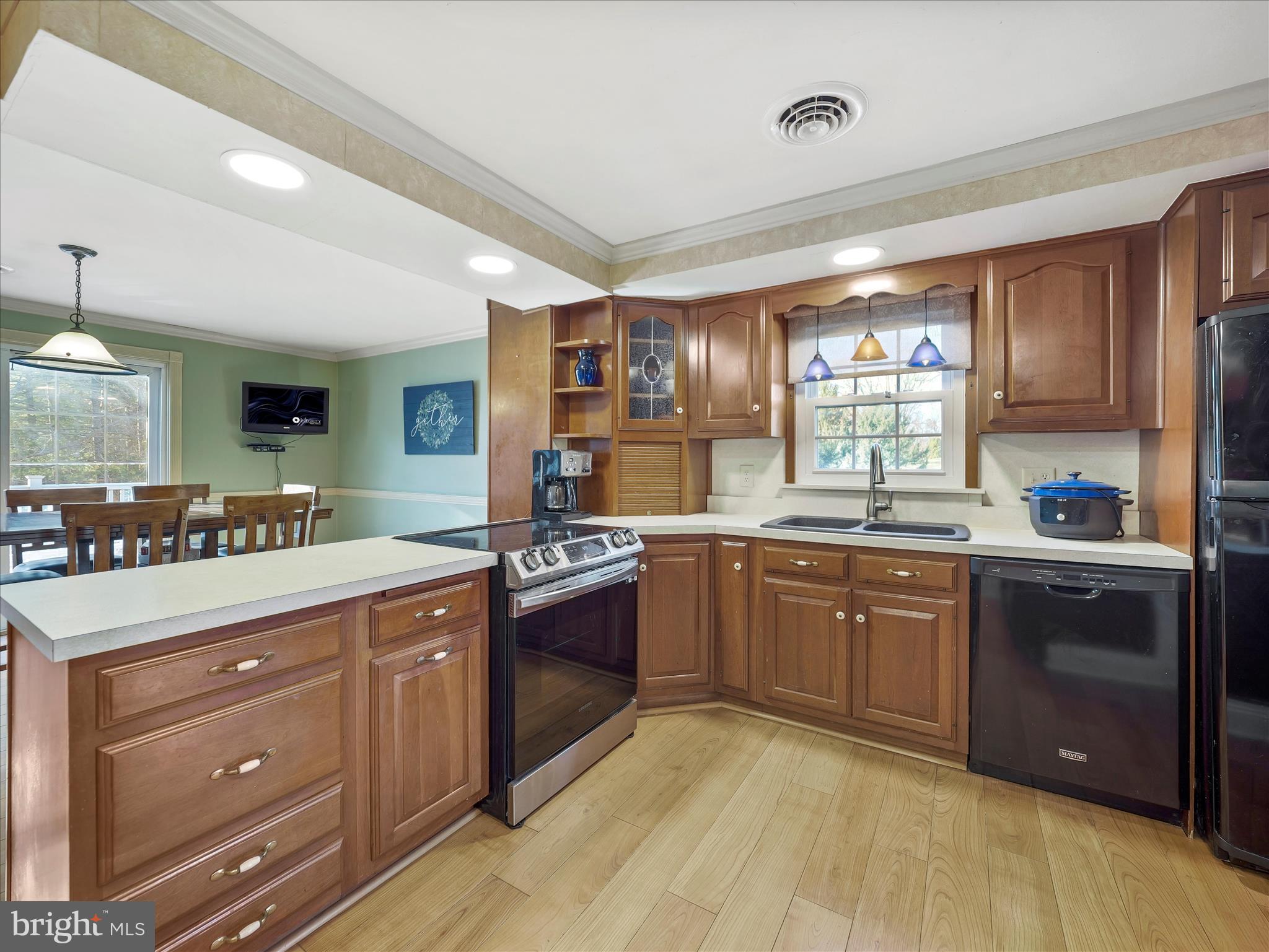 20315 Old Forge Road Hagerstown, MD 21742 - Photo 14 of 71 a kitchen with stainless steel appliances granite countertop a sink and cabinets