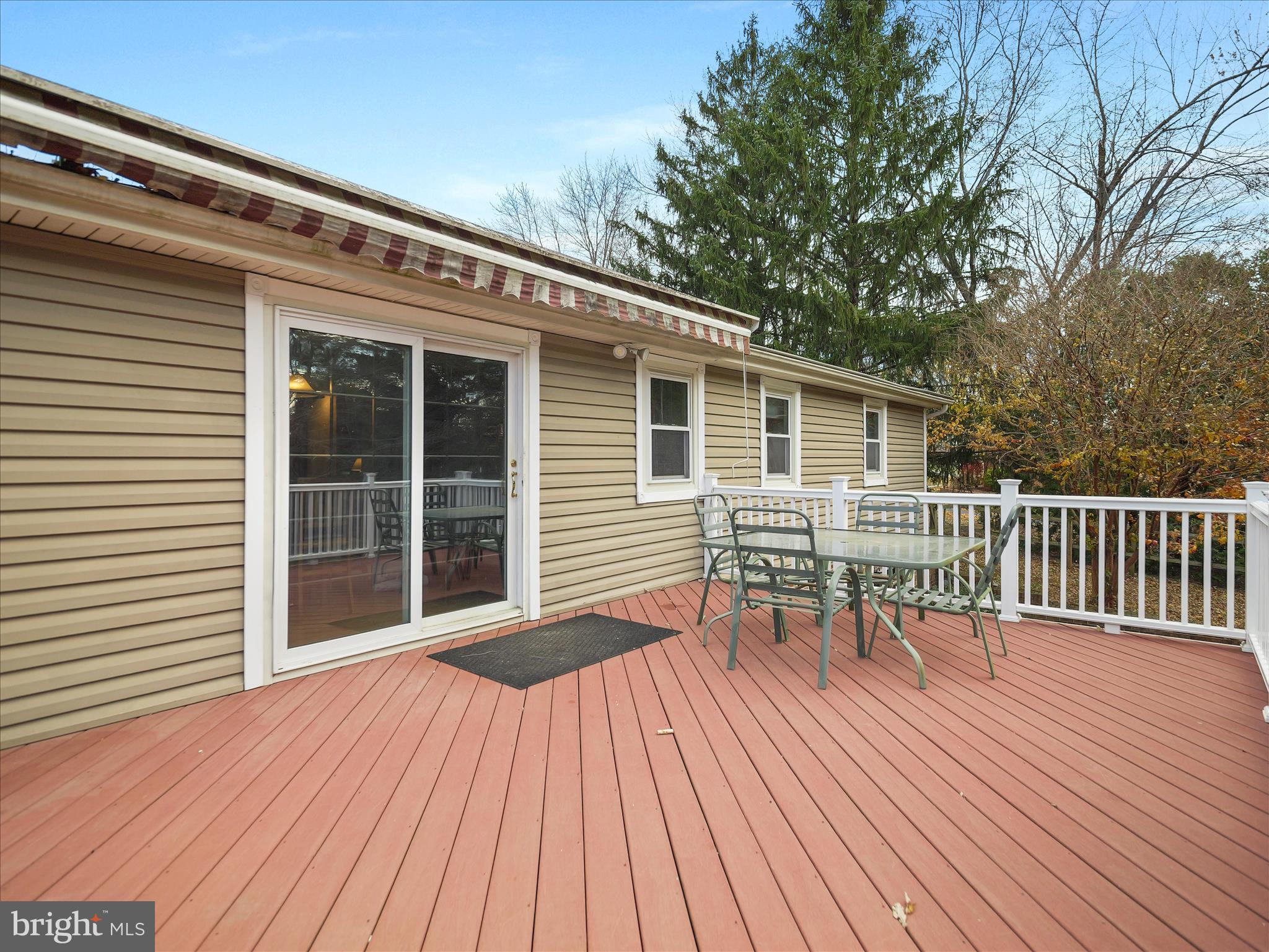 20315 Old Forge Road Hagerstown, MD 21742 - Photo 49 of 71 a view of a deck with table and chairs and wooden floor