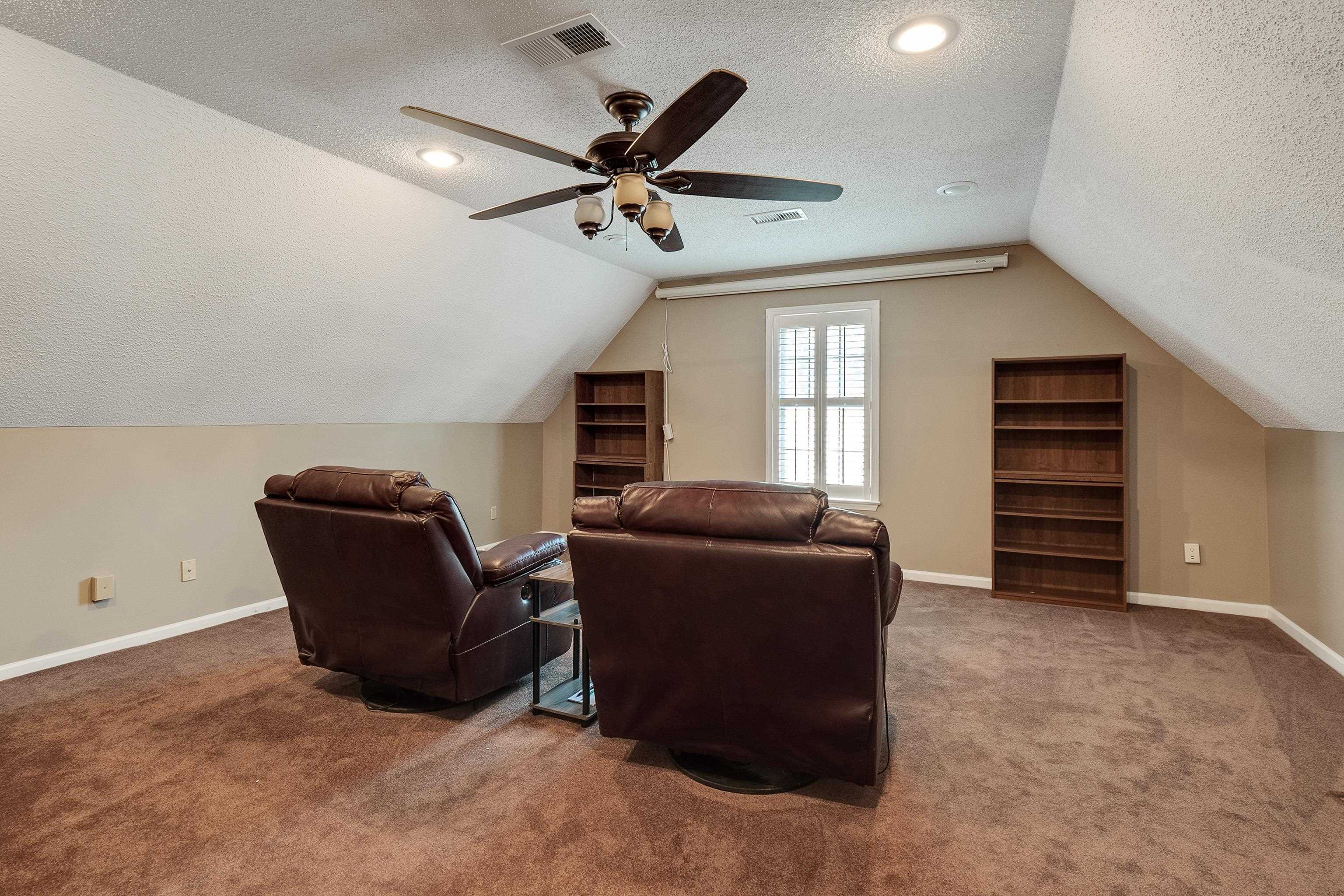 226 Wolf Ridge Cove Collierville, TN 38017 - Photo 19 of 25 a living room with furniture and a window