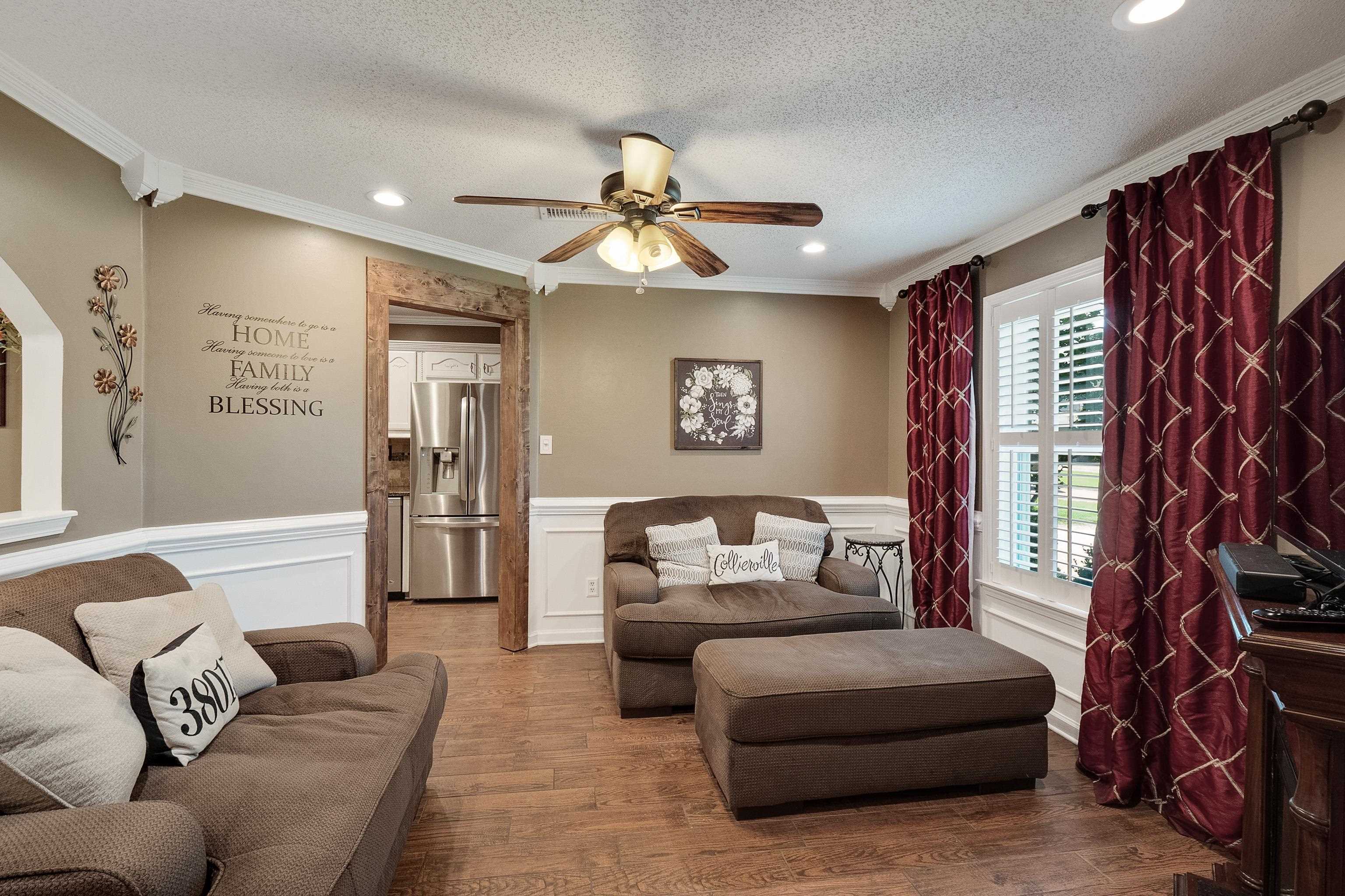 226 Wolf Ridge Cove Collierville, TN 38017 - Photo 9 of 25 a living room with furniture and a fireplace