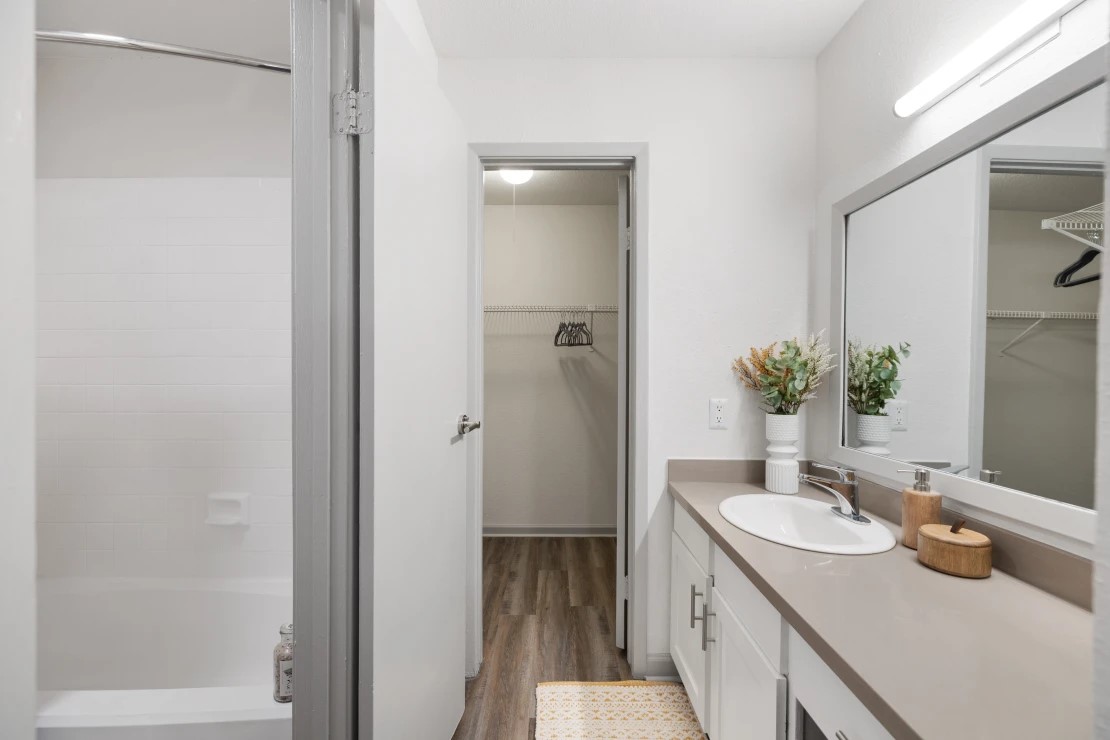 2800 South Ashford Road, Unit 1211 Houston, TX 77082 - Photo 6 of 35 a bathroom with a granite countertop sink and a mirror