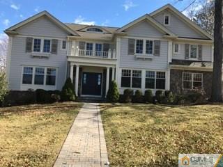 69 Athens Road Short Hills, NJ 07078 - Photo 1 of 25 a front view of a house with yard