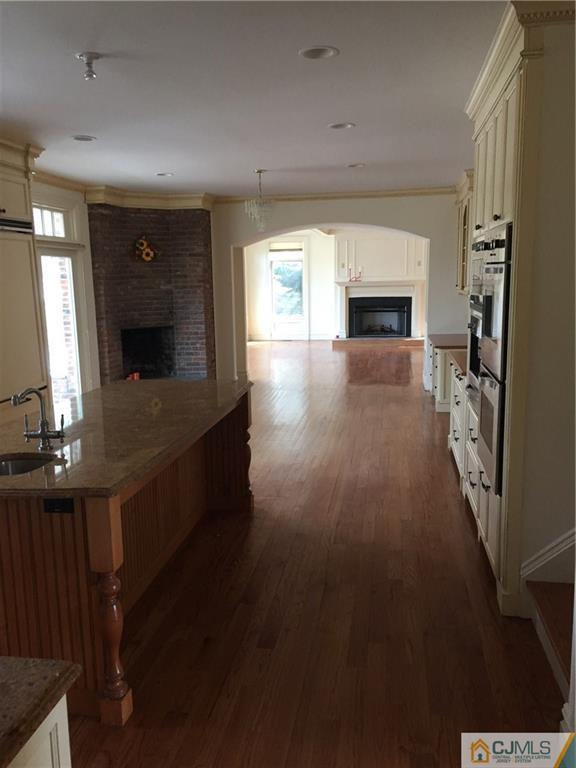 69 Athens Road Short Hills, NJ 07078 - Photo 13 of 25 a view of living room with furniture and a fireplace