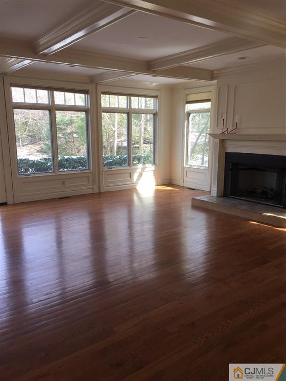 69 Athens Road Short Hills, NJ 07078 - Photo 14 of 25 a view of an empty room with wooden floor and a window