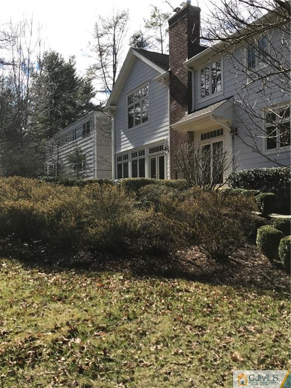 69 Athens Road Short Hills, NJ 07078 - Photo 24 of 25 a view of a brick house next to a yard