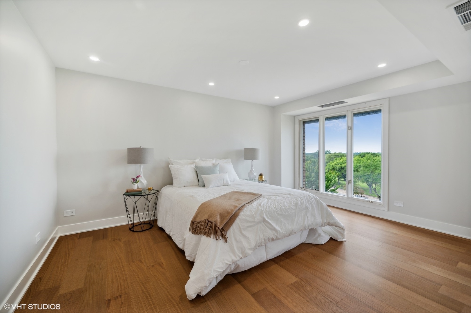 3801 Mission Hills Road, Unit 510 Northbrook, IL 60062 - Photo 11 of 21 a bedroom with a bed and a large window