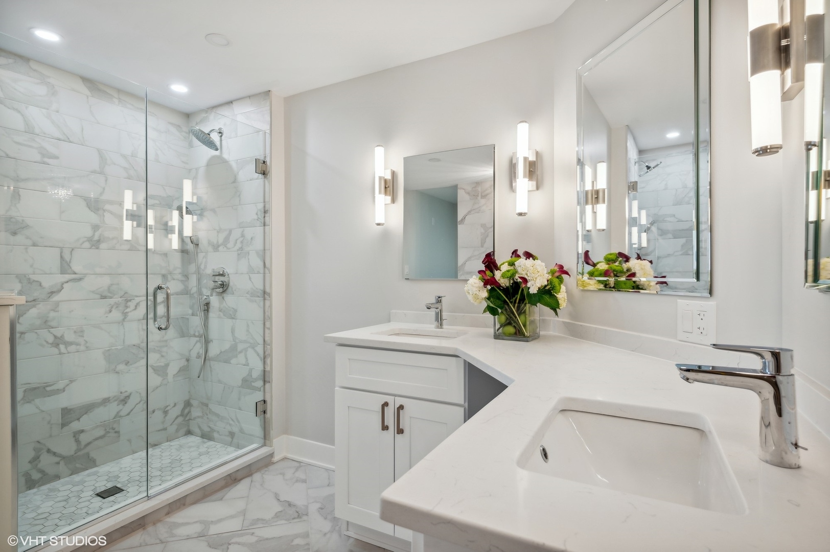 3801 Mission Hills Road, Unit 510 Northbrook, IL 60062 - Photo 12 of 21 a bathroom with a shower sink vanity and mirror