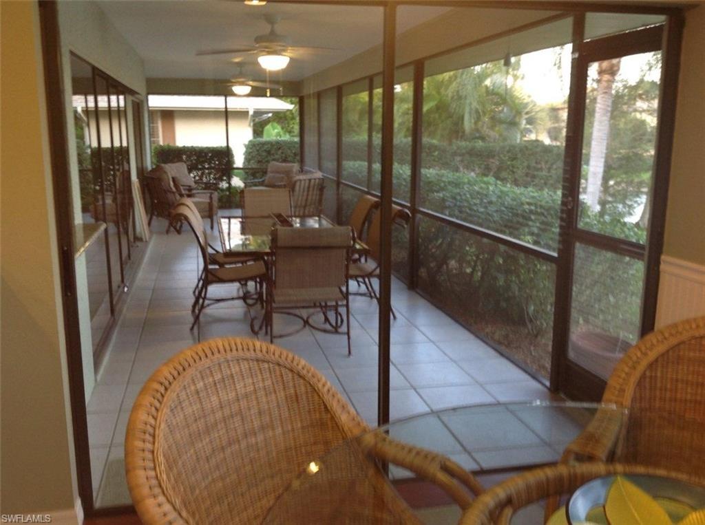 1747 Sandpiper Street, Unit B Naples, FL 34112 - Photo 16 of 29 a view of a dining room with furniture window and outside view
