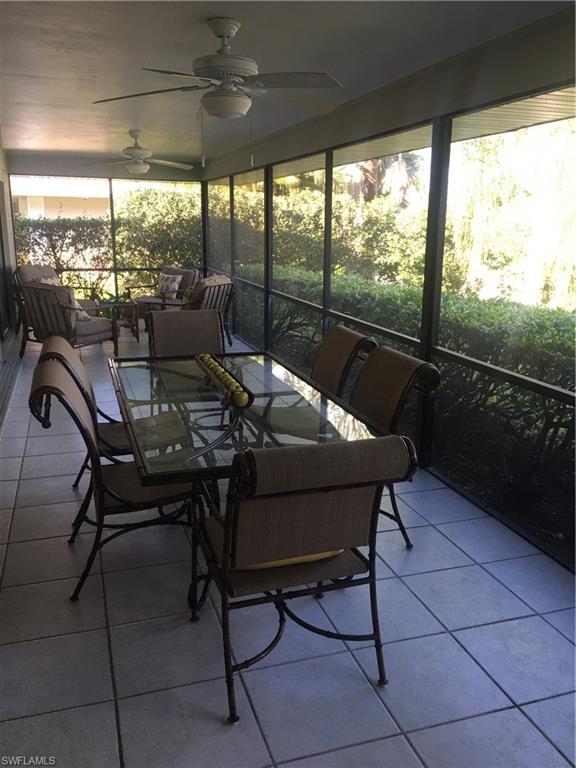 1747 Sandpiper Street, Unit B Naples, FL 34112 - Photo 17 of 29 a view of a dining room with furniture window and outside view