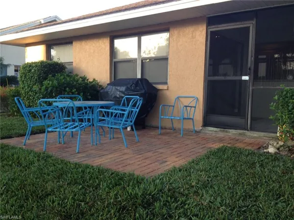 a view of backyard with seating space and deck