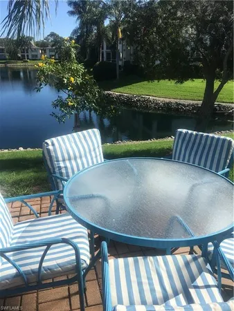 a view of a swimming pool with a patio and a garden