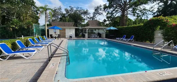 a view of a swimming pool with a patio