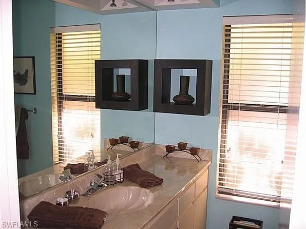 a bathroom with a sink and a window