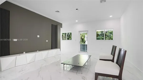 a view of a livingroom with furniture and wooden floor