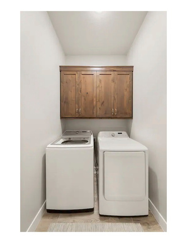 2600 Ocotillo Way, Unit 56 Santa Clara, UT 84765 - Photo 24 of 33 Laundry room with washing machine and dryer and cabinet space
