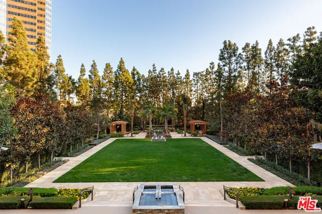 a view of yard with swimming pool and trees