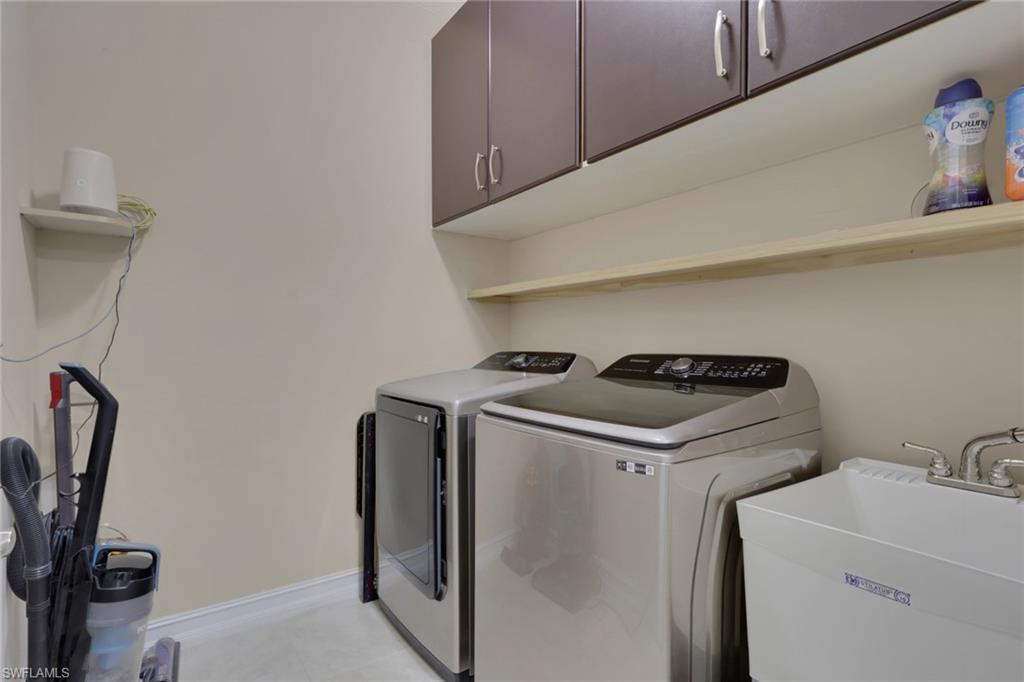16309 Aberdeen Way Naples, FL 34110 - Photo 29 of 34 a utility room with dryer and washer
