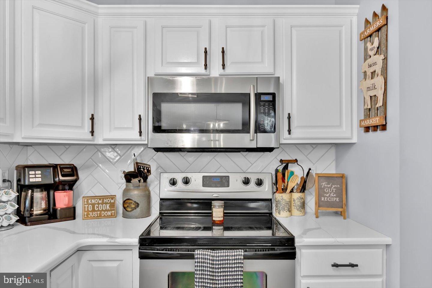 388 Sapling Way Atco, NJ 08004 - Photo 15 of 49 a kitchen with stainless steel appliances granite countertop a stove and a microwave