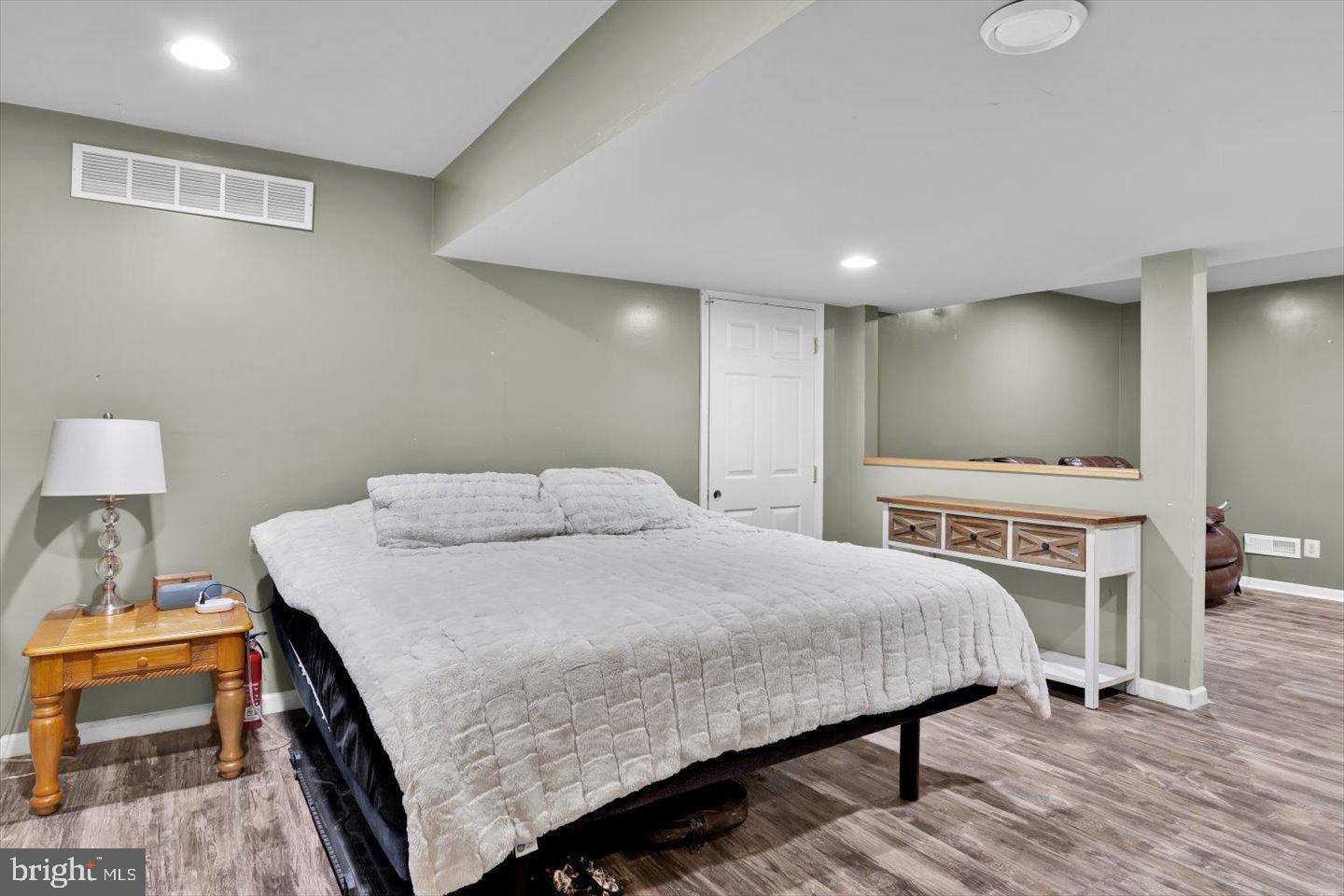 388 Sapling Way Atco, NJ 08004 - Photo 37 of 49 a bedroom with a bed a table and chair