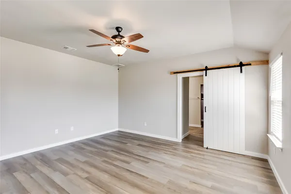 a view of room with window and ceiling fan