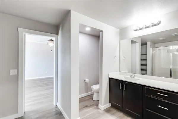 a bathroom with a glass shower door