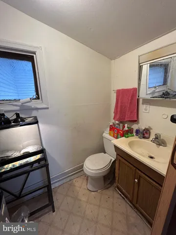 a bathroom with a toilet and a sink