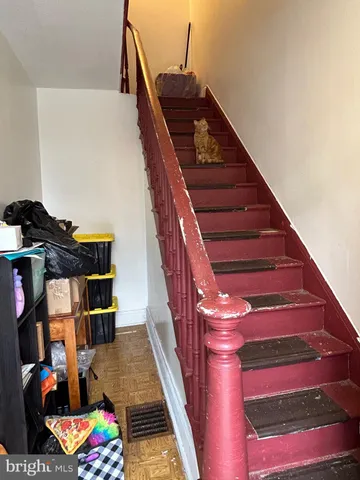 a bedroom with furniture and a flat screen tv