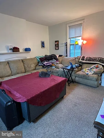 a spacious bedroom with a bed and a couch